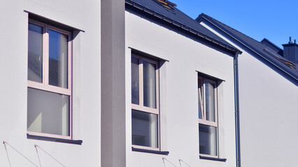 Newly built terraced houses in a residential area. Modern terraced houses on the outskirts of the city.