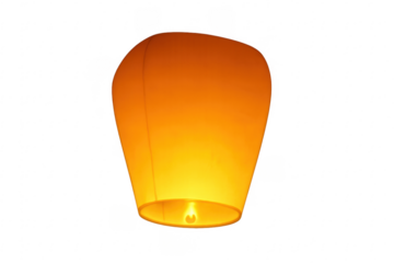 Illuminated paper lantern, a symbol of wishes and hope, flying upward