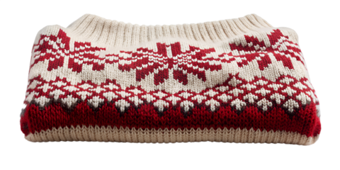 Folded red and white knitted sweater with snowflake pattern isolated on transparent background, a cozy winter garment perfect for the holiday season