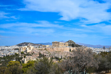 View of the Acropolis of Athens. Blue sky with clouds, travel concept.