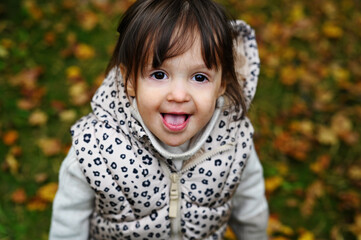 Fototapeta premium Toddler girl in autumn park