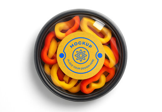 Realistic Food Packaging Mockup with Blank Circular Label &ndash; Top View Transparent Plastic Container Filled with Sliced Red and Yellow Bell Peppers for Healthy Food, Salad or Vegetable Branding Presenta