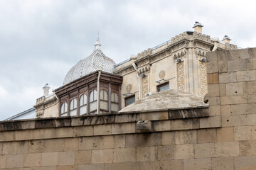 A historic building rooftop with a decorative facade and a dome. Baku, Azerbaijan