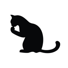 Black silhouette of a cat grooming itself in a seated position on white