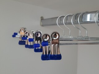 Hanger with clips for hanging clothes. Clothes-hanger for trousers and skirts securely. No label, mock up templ