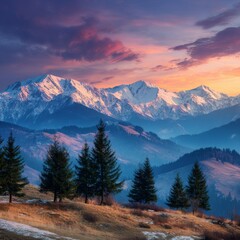 Mountain landscape of snow-capped mountains in the mist.

