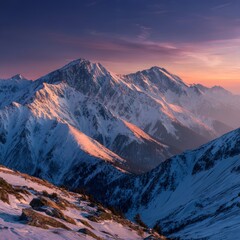 Mountain landscape of snow-capped mountains in the mist.

