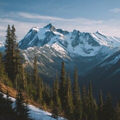 Mountain landscape of snow-capped mountains in the mist.
