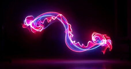 Colorful abstract light trails forming a dynamic fish shape in darkness - Powered by Adobe