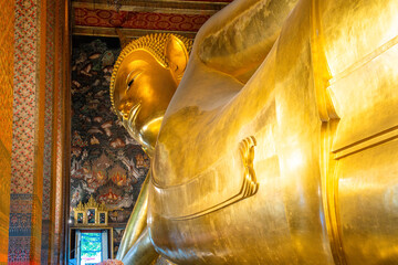 Golden Big Buddha statue in Wat Pho Temple in Bangkok city, Thailand, Asia. Temple of the Reclining Buddha. Popular tourist landmark