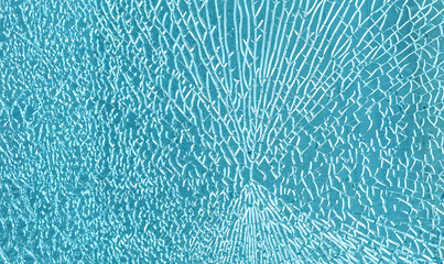 Shattered blue tempered glass texture with breaking lines