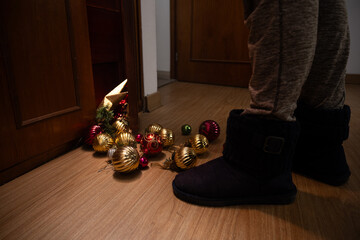 Colorful Christmas ornaments scattered across floor
