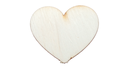 A wooden heart cutout with visible grain against a stark black background