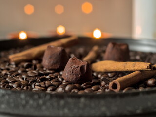 Cozy Autumn Still Life with Chocolate Truffles and Cinnamon Sticks - Decorative Tray with Coffee Beans, Spices, and Bokeh Lights