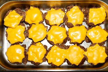 Cooked Burger Patties with Melted Cheese 
