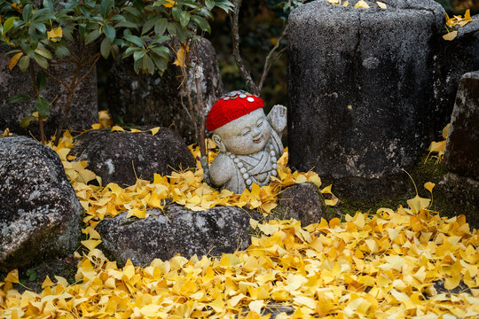 Peaceful Jizo Statue. Autumn in Miyajima, Japan