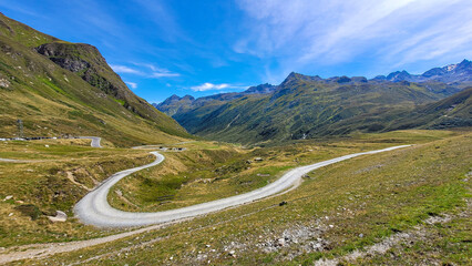 The winding mountain road in the picturesque alpine valley. Austria, Europe.