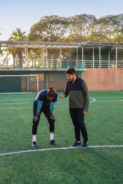 Coach talking and motivating athlete