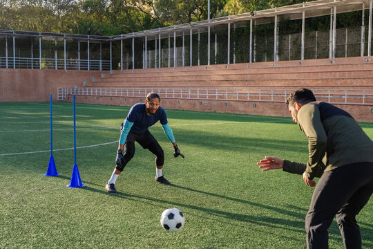 Goalkeeper training reaction and reflexes with coach