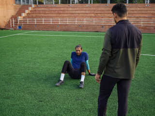 Coach talking with frustrated athlete
