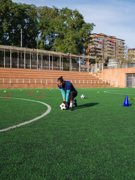 Determined man training his goalkeeping skills 