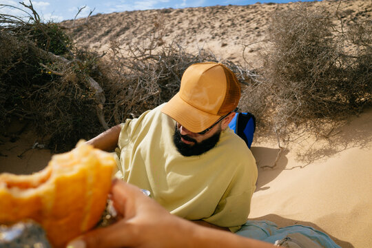 Man Enjoying Food in Desert