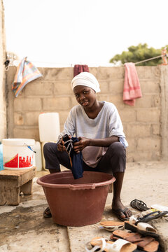 Woman hand washing laundry in Senegal, Africa