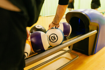 Colorful Bowling Balls on Return Rack