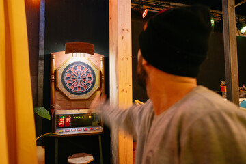 Throwing Dart Towards Target Board