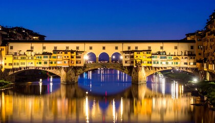 Ponte Vecchio bridge at night with reflections in the Arno River Florence Italy.