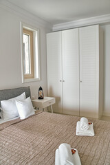 Serene Modern Bedroom Design with Minimalist Decor Featuring Soft Bedding and Elegant Wardrobe