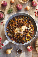 Fresh chopped plums, apples, honey, onion and spices - preparation of homemade chutney or relish