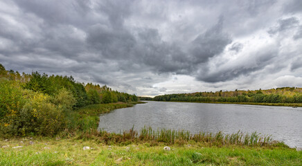 Lake with a cloudy sky in the background