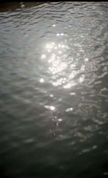 Sun flares reflection over the lake surface