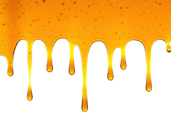 Golden honey dripping isolated on white, sweet liquid with bubbles for food and dessert concepts in...