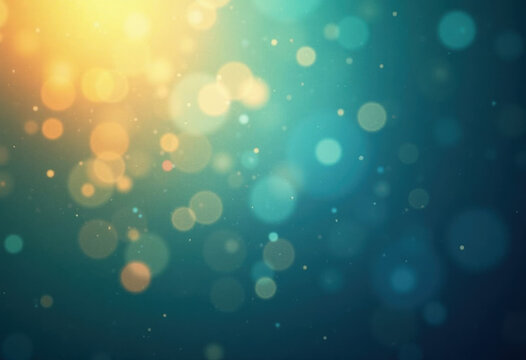 Blue and gold abstract background made in camera with a macro lens creating floating orbs of warm yellow light on a blue green backdrop