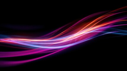 Naklejka premium Vibrant neon light trails flowing across a dark background in abstract waves