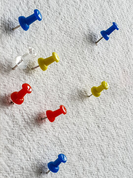 Pins on white board