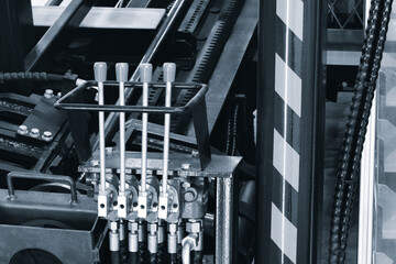 Hydraulic automatic transmission with four control levers. Industrial concept background.