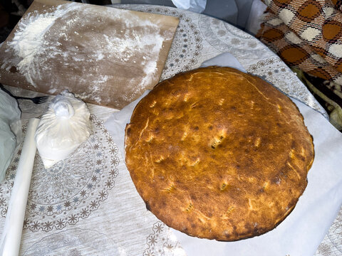 Traditional Bread Baking in Clay Pot Over Open Fire
