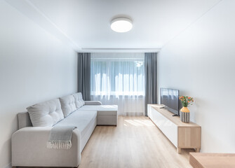 Modern Bright Living Room Interior With Sofa, TV, and Minimalist Design. Bright and stylish living room 