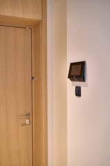 Modern Entryway Featuring a Sleek Door Design Complemented by an Innovative Control Panel for Enhanced Access and Security in Contemporary Spaces