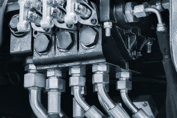 Hydraulic power drive hoses of high pressure machine, industrial power concept background.