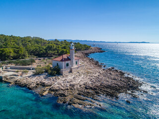 The lighthouse of Murter on the island Prisnjak in Croatia from drone view