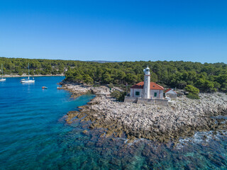 The lighthouse of Murter on the island Prisnjak in Croatia from drone view