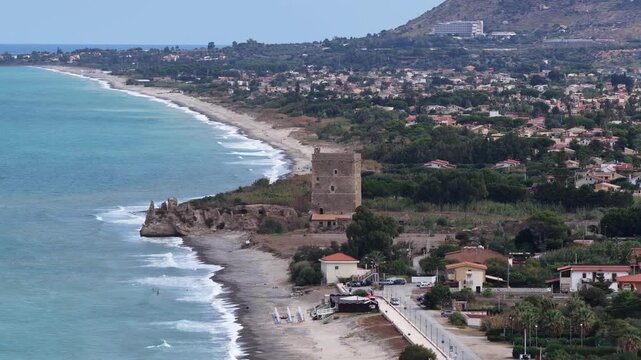Aerial drone view of Campofelice di Roccella, a charming Sicilian seaside village in northern Sicily, Italy, showing traditional holiday homes, coastline, and panoramic Tyrrhenian Sea vistas