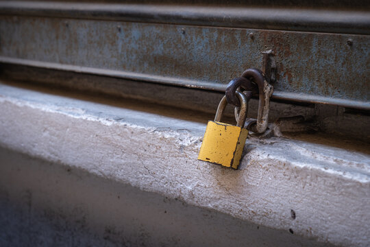 closed and padlocked shop shutters. economic crises and bankruptcies.