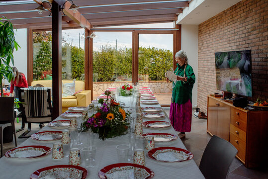 Setting up a Festive Table With Flowers in the Afternoon