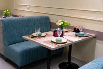 Cozy restaurant interior with table setting