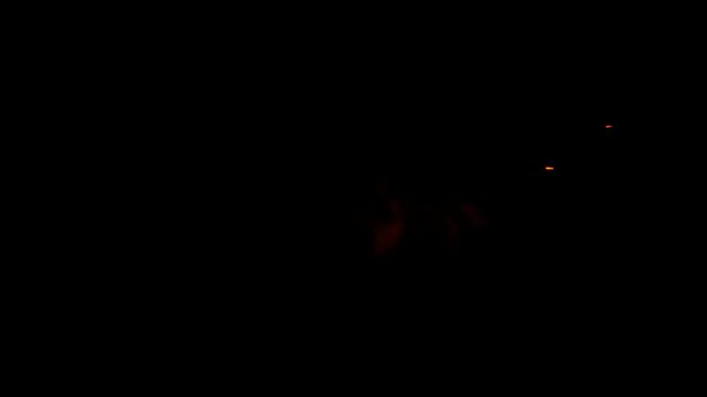 red energy spark hit effect on black background